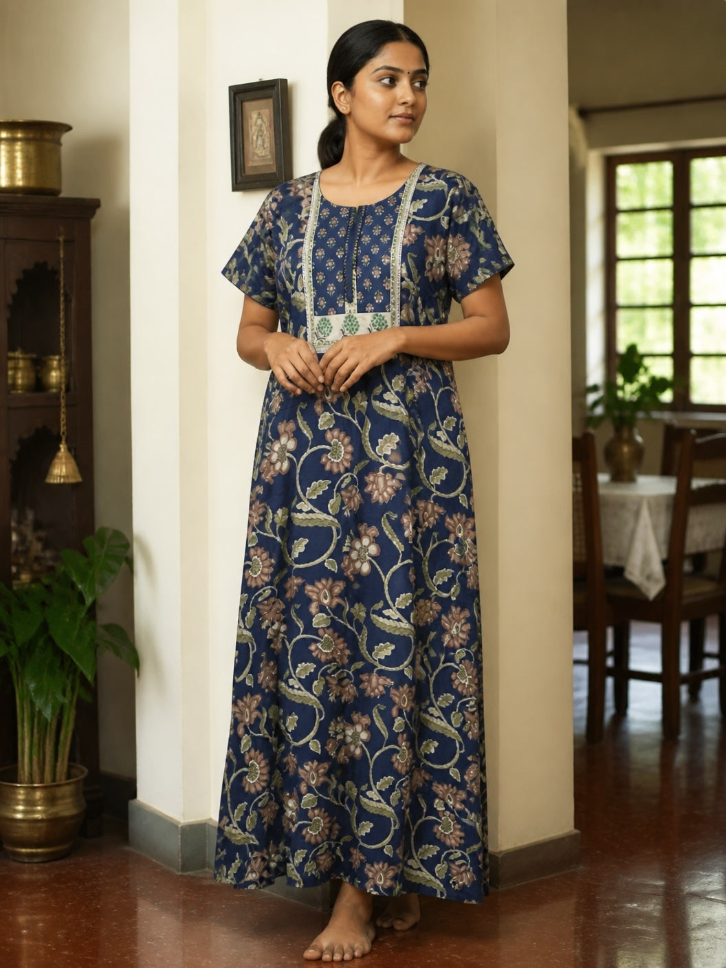 Kishona indigo blue cotton maxi dress with earthy floral print, round neckline, and delicate lace trim detailing.