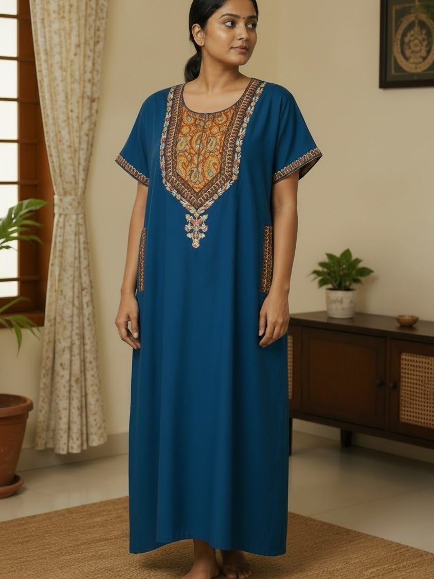 Kishona deep blue kaftan dress with intricate multi-coloured ethnic embroidery on the neckline and side pockets.